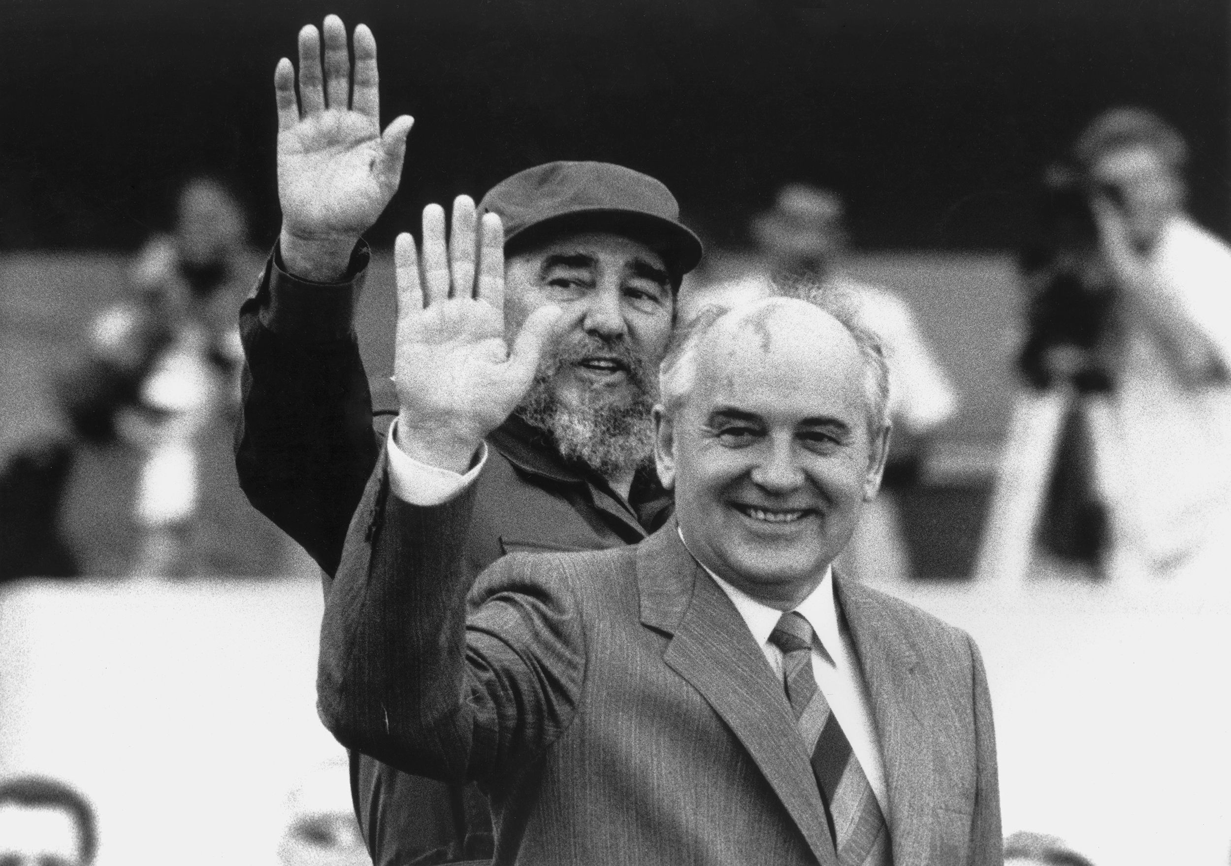 Gorbachev and Cuban President Fidel Castro wave during Gorbachev's visit to Cuba in April 1989.