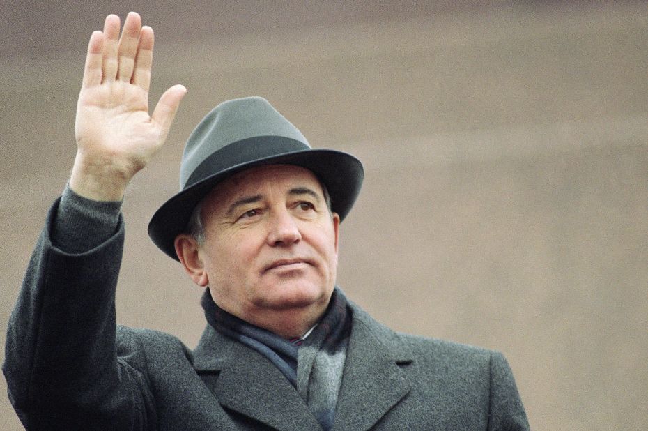 Gorbachev waves during a parade in Moscow in November 1987.