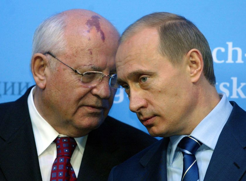 Gorbachev talks to Russian President Vladimir Putin before a news conference in Germany in December 2004.