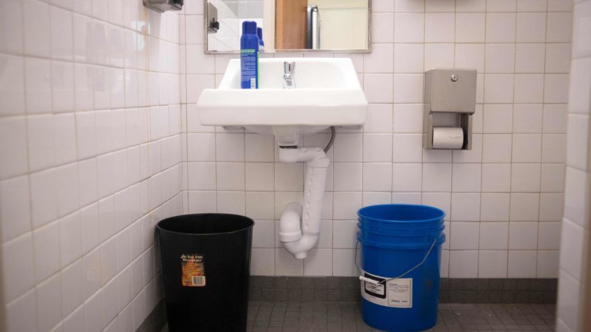 A blue bucket in a bathroom is full of water to be used for flushing the toilet at Wilkins Elementary School in Jackson, Mississippi on March 23, 2022. - Every morning, 180 students at a school in Jackson, Mississippi have to board a bus to be taken to another nearby school. The reason? Their school lacks the water pressure needed to flush its own toilets.
Cheryl Brown, the principal at Wilkins Elementary, where 98 percent of the 400 students are African-American and most come from underprivileged backgrounds, doesn't hide her frustration. (Photo by Mark Felix / AFP) (Photo by MARK FELIX/AFP /AFP via Getty Images)