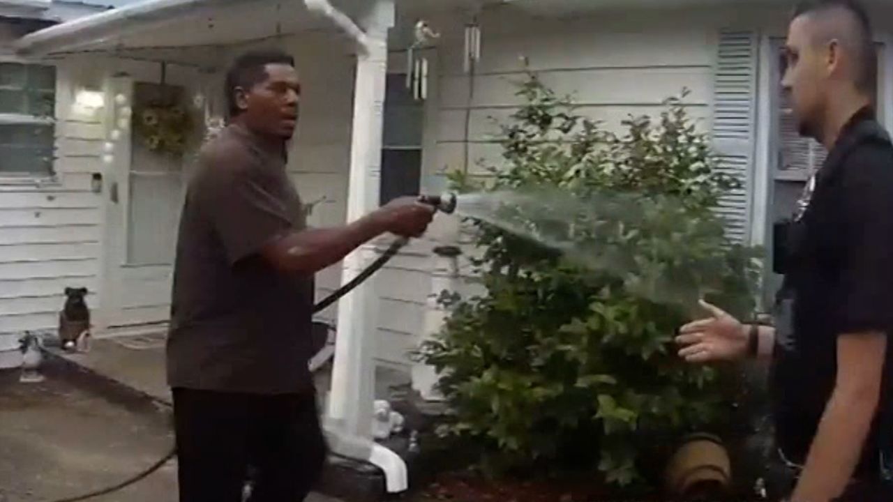 black pastor arrested watering flowers