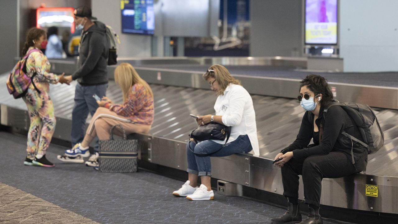 Travelers wait at LaGuardia Airport in the Queens borough of New York on July 1, 2022.