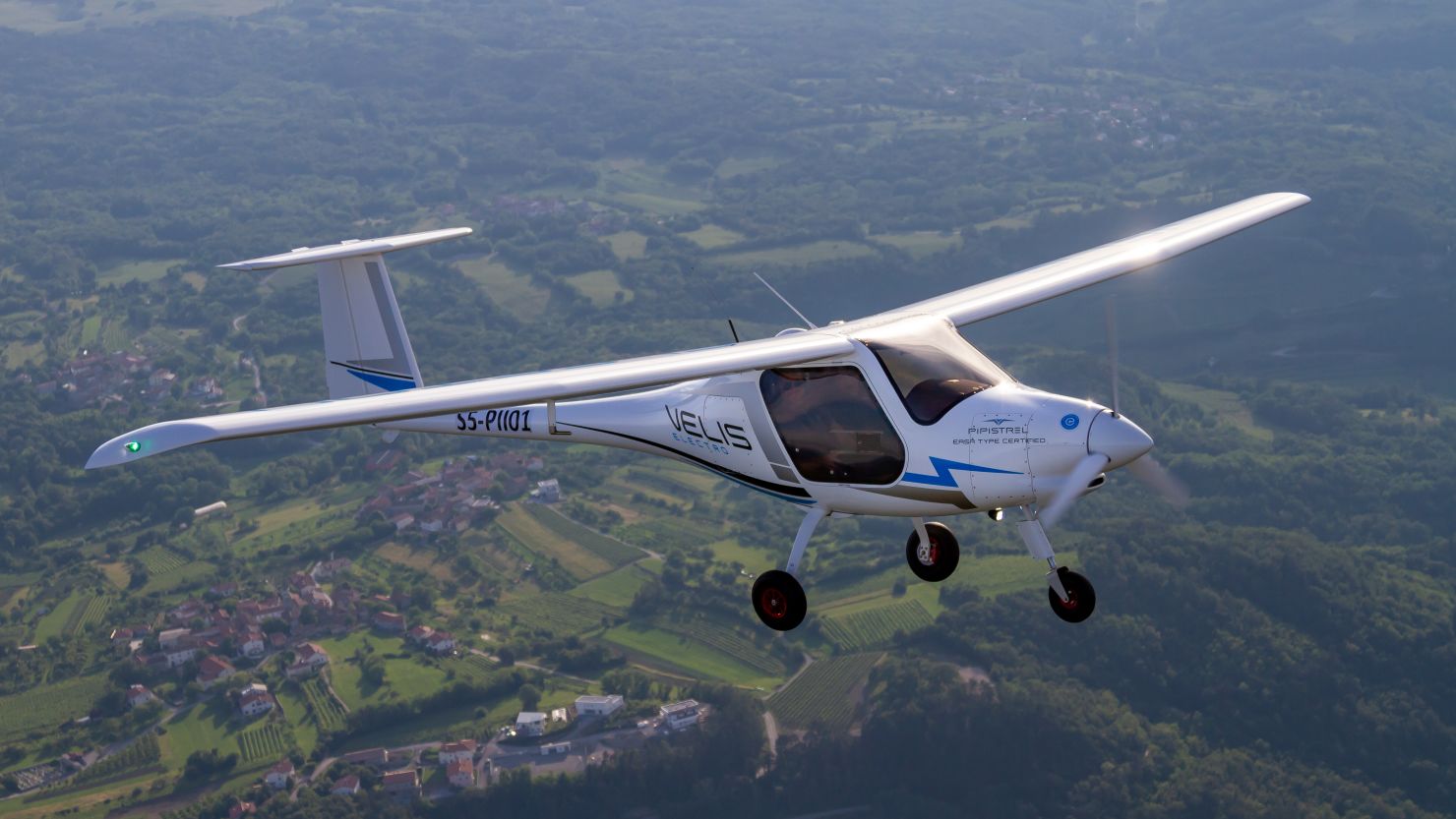 The Pipistrel Velis Electro in flight. The two-seat electric airplane produces no carbon dioxide emissions and is quieter than conventional aircraft.