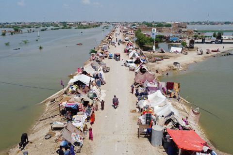 Flood-affected people take refuge at a makeshift camp in Pakistan's Jaffarabad district on Wednesday, August 31. <a href=