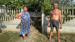 Maria Pokusaeva (L) and her son Oleksandr pose for a picture in southern Ukraine.