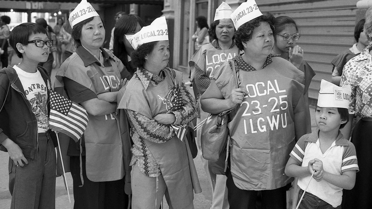 Members of the International Ladies Garment Workers Union stand on 5th Avenue during the Labor Day Parade, in New York, New York, on September 6, 1982. 