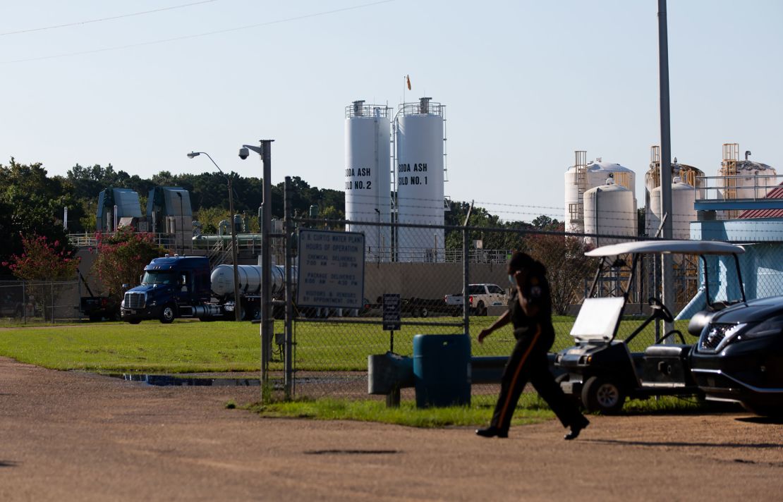 A security guard is seen outside of O.B. Curtis Water Plant on August 31.