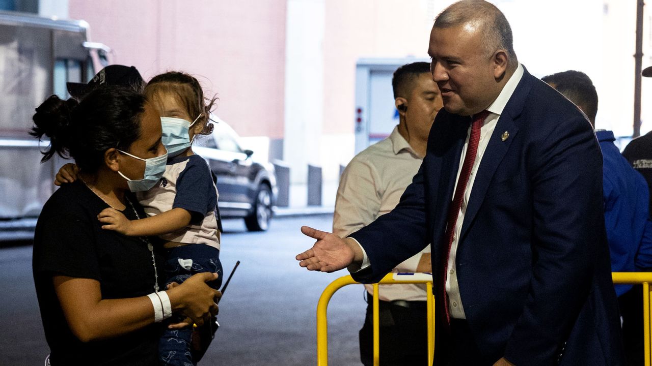 Manuel Castro greets migrants exiting a bus from Texas at the Port Authority on August 30. Castro himself crossed the US-Mexico border with his mother when he was 5.