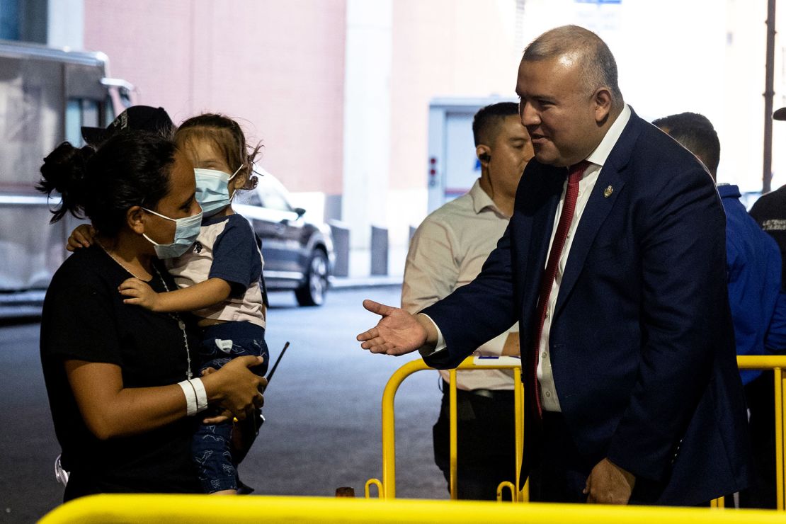 Manuel Castro greets migrants exiting a bus from Texas at the Port Authority on August 30. Castro himself crossed the US-Mexico border with his mother when he was 5.