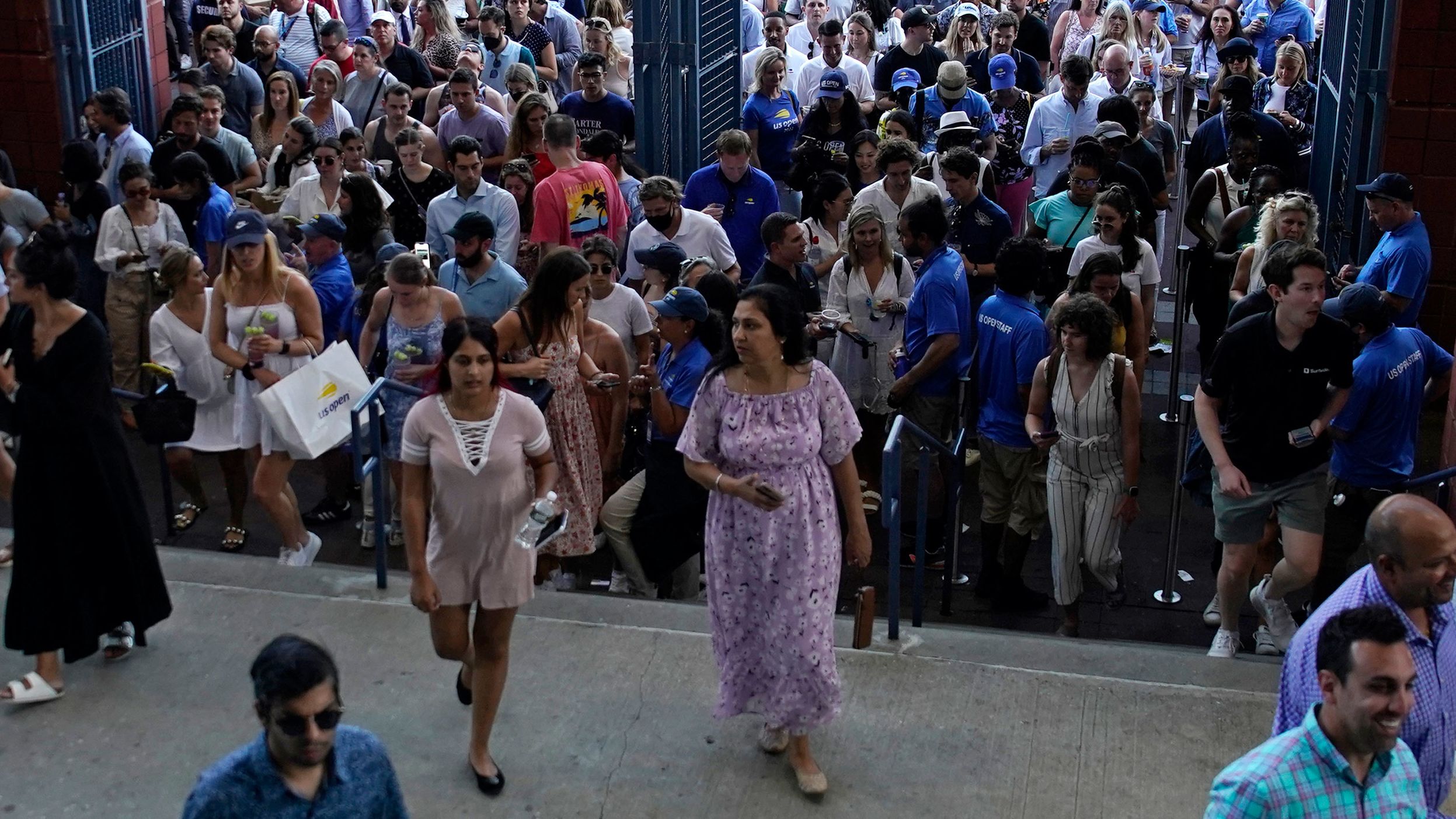 Fans enter Arthur Ashe Stadium for Wednesday's match.