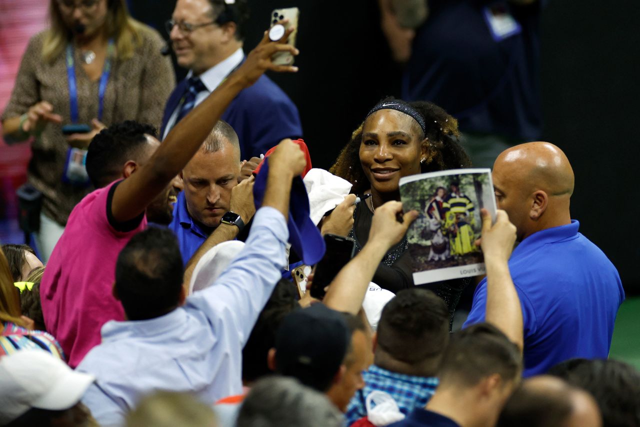 Williams takes pictures with fans at Arthur Ashe Stadium after her second-round singles win on Wednesday. She knocked off second-seeded Anett Kontaveit 7-6 (4), 2-6, 6-2.