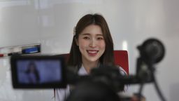 In this Thursday, Feb. 20, 2020, photo, Kang Na-ra, a Youtuber who defected in 2014, smiles during an interview in Seoul, South Korea. South Korea's latest hit drama "Crash landing on you" portrays the fantastical story of a billionaire heiress accidentally paragliding into North Korea and falling in love with army captain. The drama is a few reminders of Kang's faraway home. (AP Photo/Ahn Young-joon)