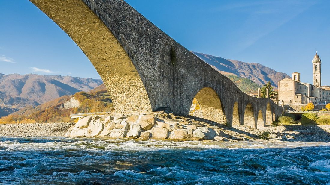 <strong>Bobbio: </strong>The imposing Ponte Gobbo, an ancient stone bridge that crosses the chilly Trebbia river to connect Bobbio to the main road, is one of the many things to see in this pretty village in the Italian region of Emilia-Romagna.