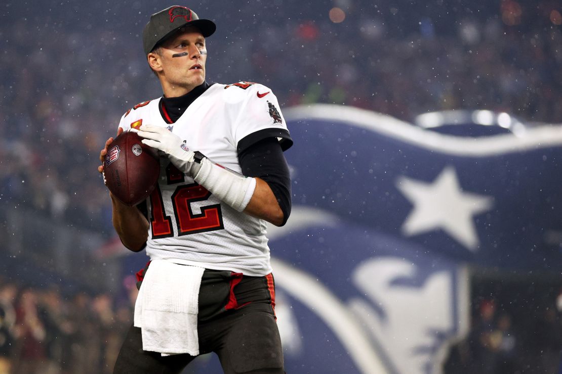 Brady warms up in front of the New England Patriots tunnel before the game between the Buccaneers and the Patriots at Gillette Stadium on October 3, 2021.