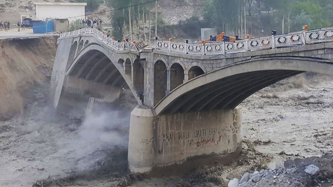 A bridge partially collapses due to flash flooding from a glacial lake outburst in Hassanabad village, in Pakistan's northern Hunza district in May.