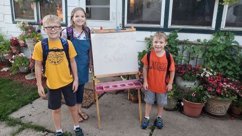Molly Schmitz said her three children Jack, Lily and Jase are recyling and reusing many of their school supplies, including backpacks, this year.