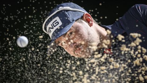 Pro golfer Thriston Lawrence plays a shot from a bunker during the final round of the European Masters in Switzerland on Sunday, August 28. He won the event in a playoff.
