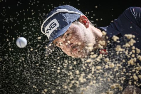 Pro golfer Thriston Lawrence plays a shot from a bunker during the final round of the European Masters in Switzerland on Sunday, August 28. He won the event in a playoff.