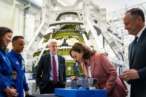 US Vice President Kamala Harris and her husband, Doug Emhoff, sign a piece of Artemis III hardware while touring the Kennedy Space Center in Florida on Monday, August 29.