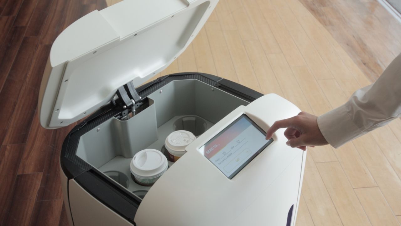 Customers receive a PIN code, enabling them to open the hatch in Rice's "head" to retrieve their drinks.