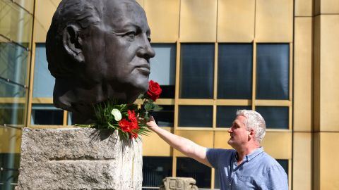 A man places a rose on a sculpture of <a href="http://www.cnn.com/2022/08/30/europe/gallery/mikhail-gorbachev/index.html" target="_blank">Mikhail Gorbachev</a> at the Fathers of Unity memorial in Berlin on Wednesday, August 31. Gorbachev, the last leader of the former Soviet Union, <a href="https://www.cnn.com/2022/08/30/europe/mikhail-gorbachev-dies-intl/index.html" target="_blank">died Tuesday night</a> at the age of 91. He was credited with introducing key reforms to the USSR and helping to end the Cold War.