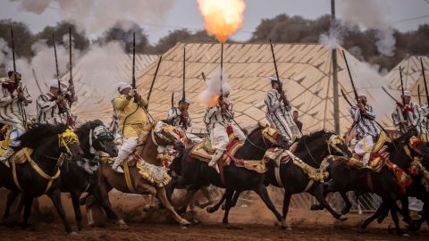 Horsemen in Rabat, Morocco, fire their rifles while performing at a Moussem culture and heritage festival on Saturday, August 27.
