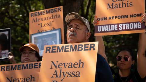 Joe Martinez, center, takes part in a March for Our Lives rally in Austin, Texas, on Saturday, August 27. The crowd was showing support for the families who lost loved ones in <a href="http://www.cnn.com/2022/05/24/us/gallery/uvalde-texas-school-shooting-photos/index.html" target="_blank">May's school shooting in Uvalde, Texas.</a>