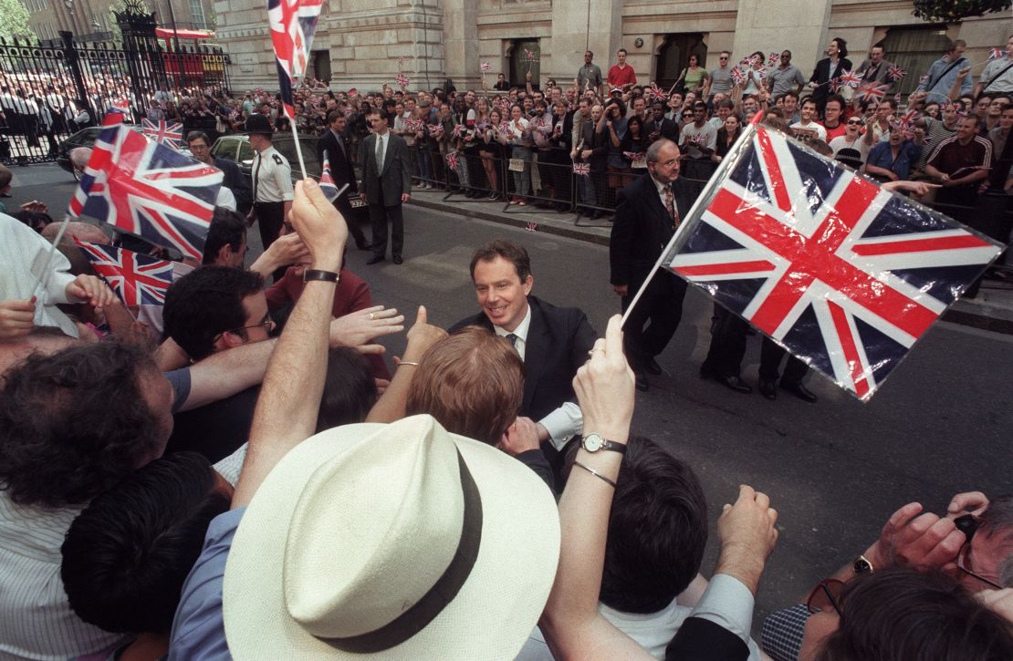Tony Blair greets Labour supporters outside 10 Downing Street after a historic landslide election in May 1997.