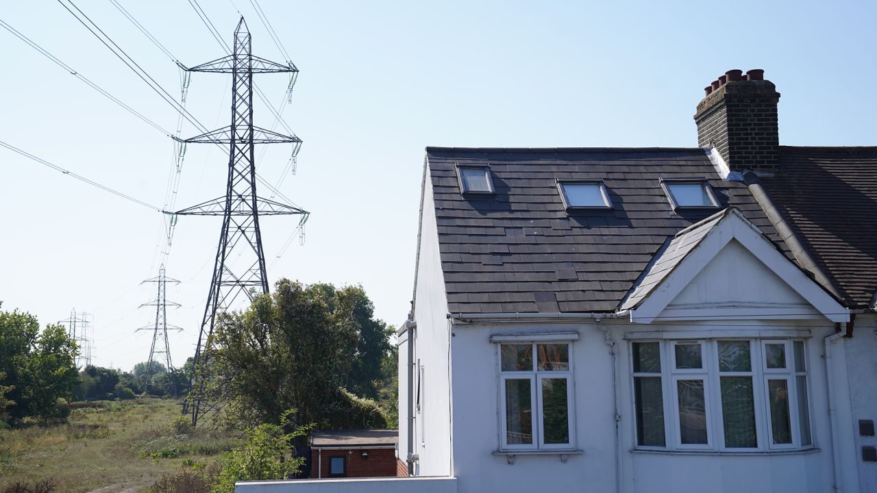 Electricity pylons in East London on Aug. 25. The country's regulator has confirmed energy bills could rise 80% in October.