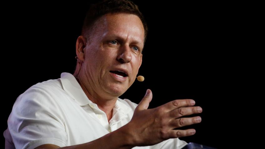MIAMI, FLORIDA - APRIL 7: Peter Thiel, co-founder of PayPal, Palantir Technologies, and Founders Fund, gestures as he speaks during the Bitcoin 2022 Conference at Miami Beach Convention Center on April 7, 2022 in Miami, Florida. The worlds largest bitcoin conference runs from April 6-9, expecting over 30,000 people in attendance and over 7 million live stream viewers worldwide.(Photo by Marco Bello/Getty Images)