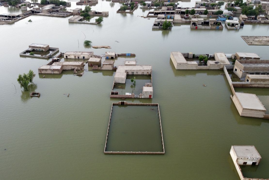 Homes are surrounded by floodwaters in Jaffarabad, a district of Pakistan's southwestern Balochistan Province, on September 1, 2022.