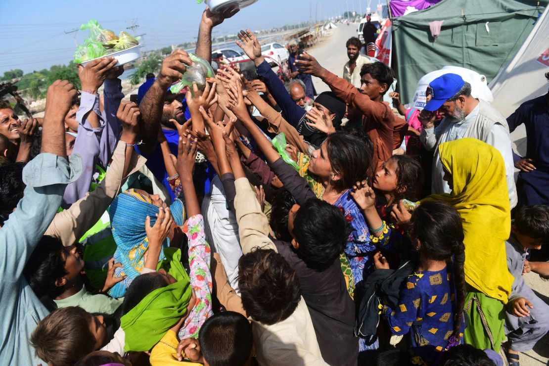 The Alkhidmat Foundation distributes food bags at a makeshift camp in Sindh Province, Pakistan on September 1, 2022.