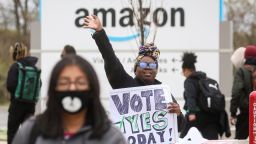 An Amazon Labour Union (ALU) organizer greets workers outside Amazon's LDJ5 sortation center, as employees begin voting to unionize a second warehouse in the Staten Island borough of New York City, U.S. April 25, 2022.  