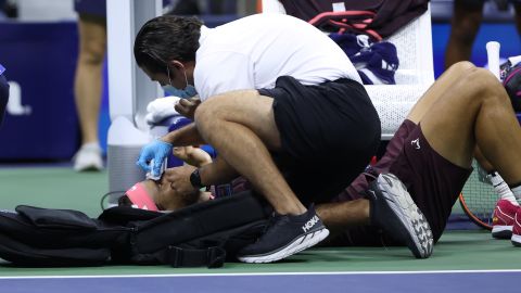 Nadal receives medical attention after accidentally hitting his head with his racket.