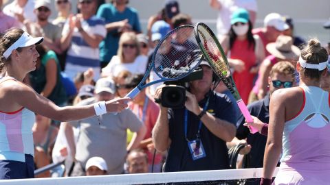 Azarenka (left) and Kostyuk (right) tap rackets following their second-round match at the US Open. 