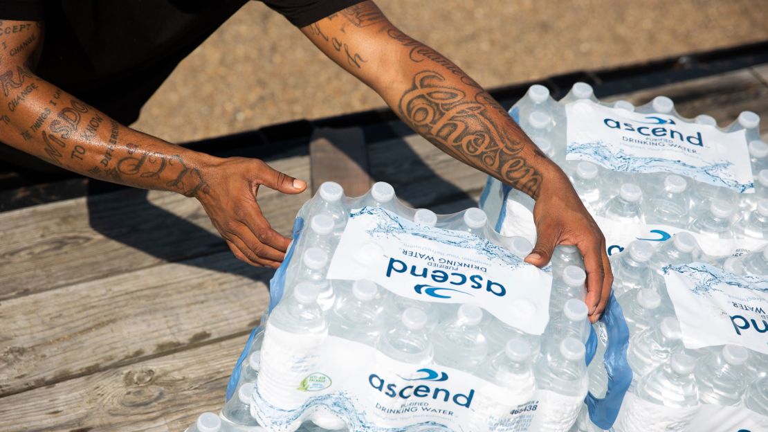 Malcolm Pickett distributes water outside New Jerusalem Church in Jackson, Mississippi, on August 31.