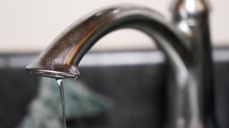 A trickle of water comes out of a faucet at a senior living apartment in Jackson on September 1, 2022.