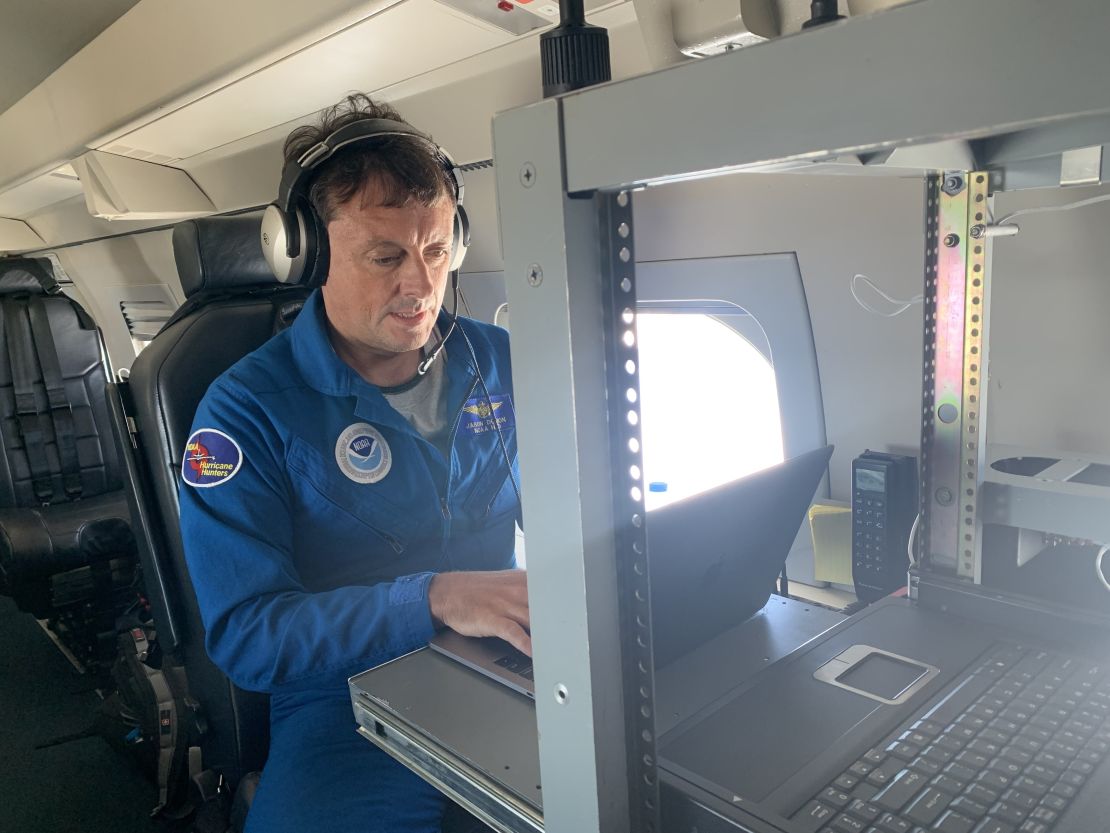 Jason Dunion analyzes real-time data from a disturbance near Cape Verde while on the hurricane hunter aircraft flies through the storm.