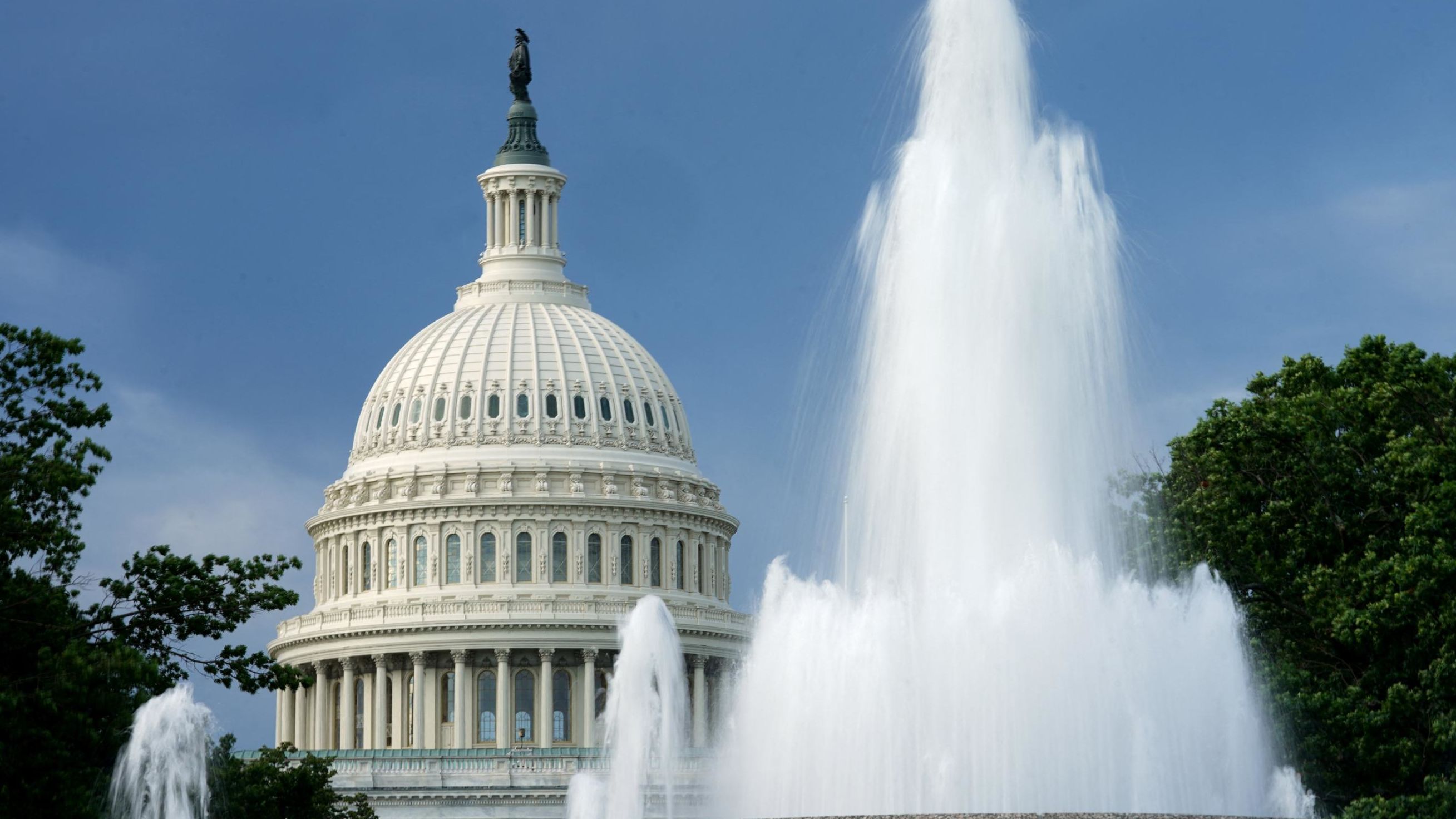The dome of the US Capitol is seen beyond a fountain earlier this year in Washington, DC. 
