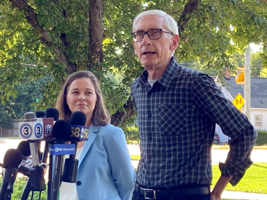 Wisconsin Gov. Tony Evers, here with his running mate, Sara Rodriguez, in Madison on August 10, 2022, is seeking a second term in November. 
