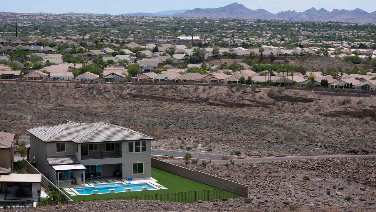 A home with a swimming pool abuts the desert on the edge of the Las Vegas Valley.
