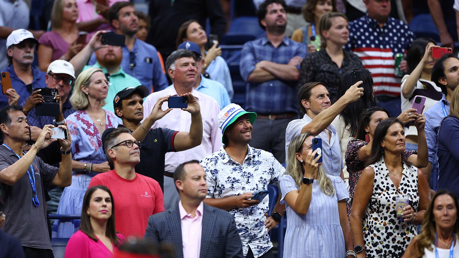 Fans watch as Williams is introduced at Arthur Ashe Stadium on Friday.