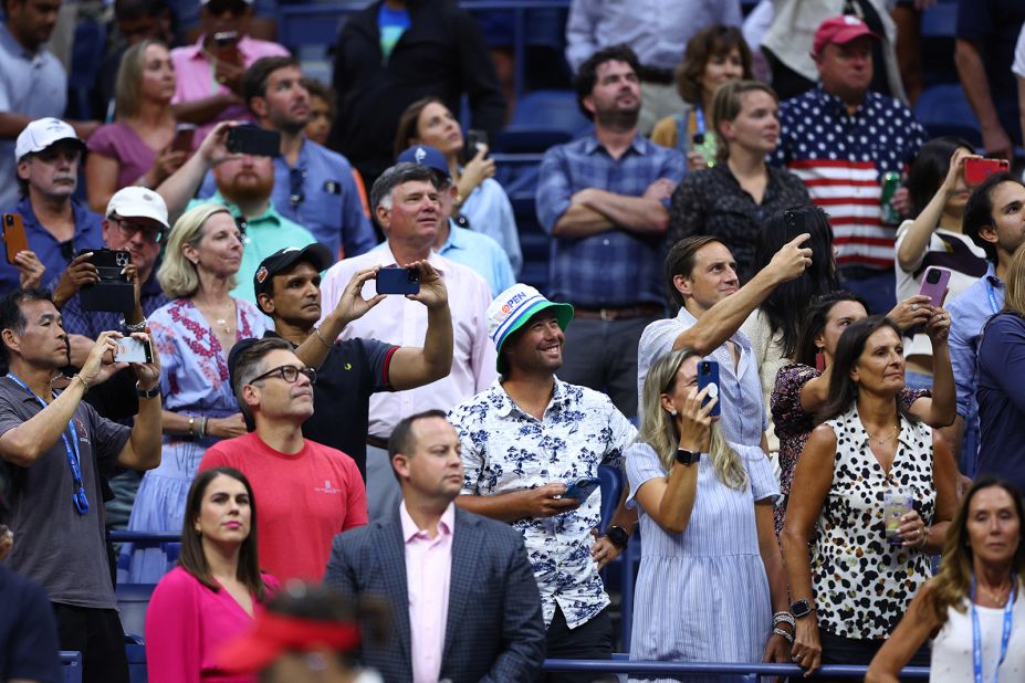 Fans watch as Williams is introduced at Arthur Ashe Stadium on Friday.