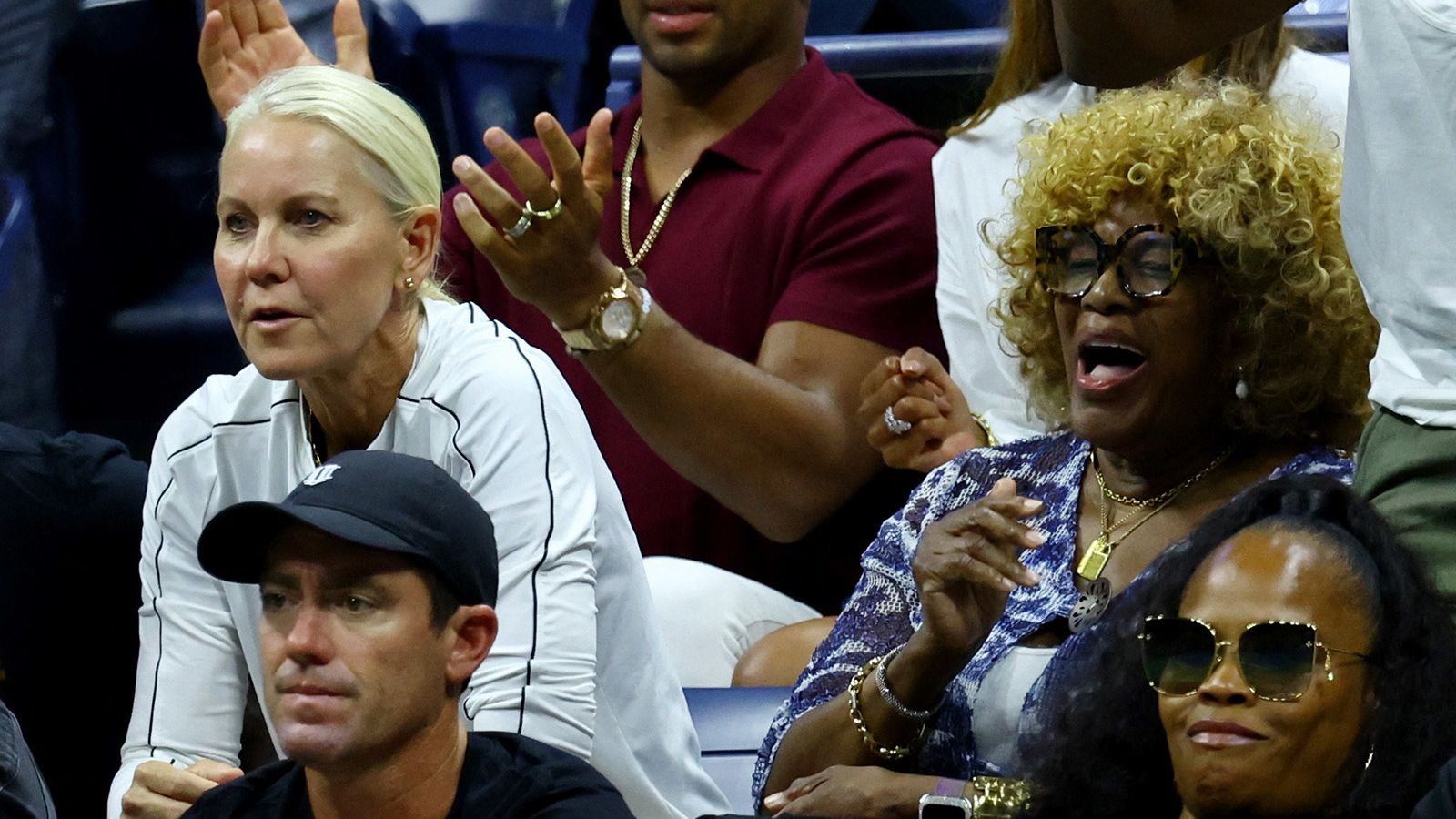 Williams' coach, Rennae Stubbs, and mother, Oracene Price, watch on Friday.