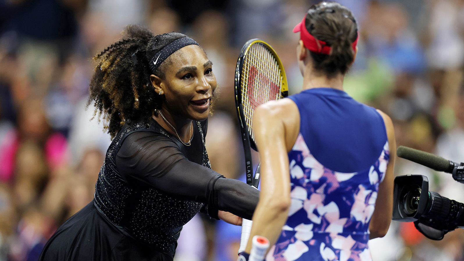 Williams shakes hands with Tomljanović after the match.