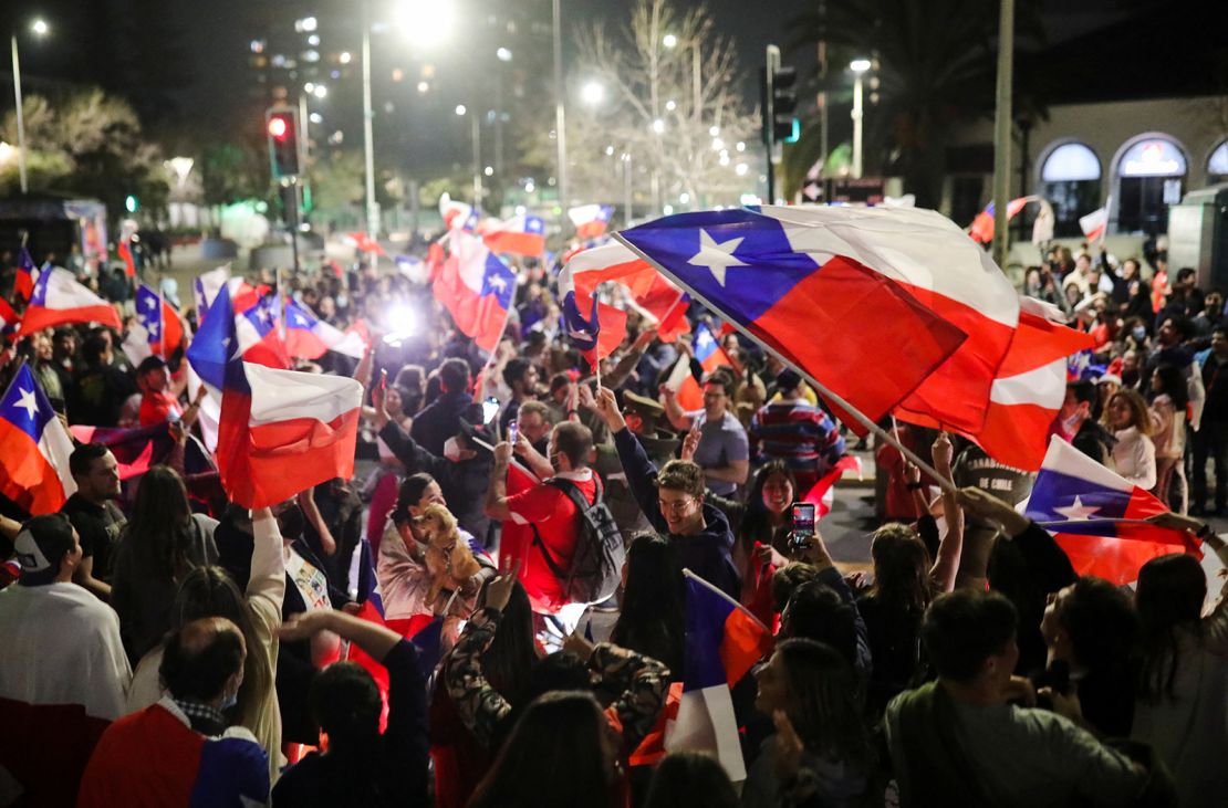 Some waved flags as they celebrated the rejection of the proposed constitution.