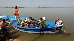 Flood victims receive relief aid from the Islamic group Jamaat-e-Islami Pakistan, in Sindh province's Sukkur city that sits on the western bank on the Indus River on September 4, 2022. 