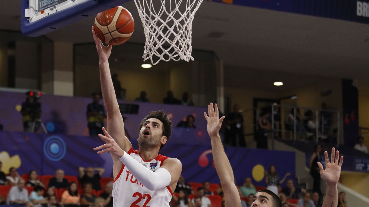 Furkan Korkmaz in action against Georgia's Rati Andronikashvili during a EuroBasket 2022 Group A match in Tbilisi, Georgia on September 4.