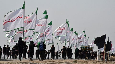 Iraqi Shiite Muslim pilgrims march from the country's southern Dhi Qar province to the holy city of Karbala, ahead of the Arbaeen religious festival, on Saturday. Each year, pilgrims converge in large numbers to the holy Iraqi cities of Najaf and Karbala ahead of Arbaeen, which marks the 40th day after Ashura, commemorating the seventh century killing of Prophet Mohammed's grandson Imam Hussein.