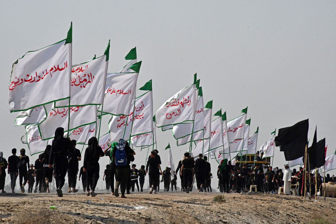 Iraqi Shiite Muslim pilgrims march from the country's southern Dhi Qar province to the holy city of Karbala, ahead of the Arbaeen religious festival, on Saturday. Each year, pilgrims converge in large numbers to the holy Iraqi cities of Najaf and Karbala ahead of Arbaeen, which marks the 40th day after Ashura, commemorating the seventh century killing of Prophet Mohammed's grandson Imam Hussein. 